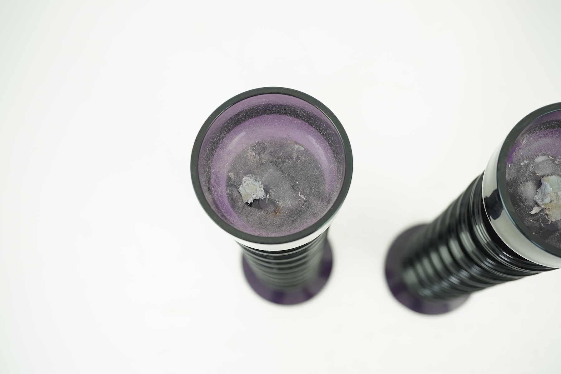 Ronald Stennett-Wilson (1915-2009) for Wedgwood: A pair of nine-ring 'Sheringham' amethyst glass candlesticks